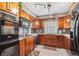 Charming kitchen with stainless steel appliances, tile backsplash, and granite countertops at 9938 Grove Way # B, Westminster, CO 80031