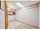 Laundry room featuring tile floors and built-in shelving at 9938 Grove Way # B, Westminster, CO 80031