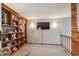 Cozy living room featuring built-in shelves, sconces, and neutral wall color at 9938 Grove Way # B, Westminster, CO 80031
