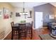 Cozy dining room with seating for four, stylish decor, and abundant light that makes it ideal for meals at 8481 W Union Ave # 2-201, Littleton, CO 80123