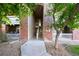 Attractive condo building with brick entryway and lush greenery, offering a welcoming and well-maintained exterior at 8481 W Union Ave # 2-201, Littleton, CO 80123