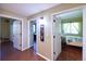 Hallway with hardwood floors and access to bedroom and bathroom at 8481 W Union Ave # 2-201, Littleton, CO 80123