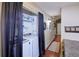 Convenient laundry closet with black curtain, washer and dryer at 8481 W Union Ave # 2-201, Littleton, CO 80123