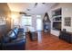 Comfortable living room with a fireplace, vaulted ceilings, and ample natural light. Stylish furnishings at 8481 W Union Ave # 2-201, Littleton, CO 80123