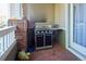 Cozy outdoor patio with a built-in stainless steel gas grill and outdoor decor at 8481 W Union Ave # 2-201, Littleton, CO 80123