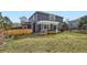 Beautiful backyard with a hot tub, patio, spacious lawn, and mature trees, perfect for entertaining and relaxation at 16442 Bluebonnet Dr, Parker, CO 80134