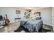 This modern bedroom features a sleek black rug, stylish bed, and unique decor at 16442 Bluebonnet Dr, Parker, CO 80134