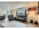 Open-concept living room with updated flooring, comfortable seating, and modern decor at 16442 Bluebonnet Dr, Parker, CO 80134