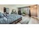 Serene main bedroom with large window, neutral tones, and stylish furnishings at 16442 Bluebonnet Dr, Parker, CO 80134