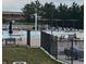 Community pool area with a splash pad, lounge chairs, shaded seating and mature trees in the background at 16442 Bluebonnet Dr, Parker, CO 80134