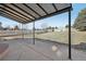 Covered patio with concrete flooring, surrounded by a well-maintained fenced backyard at 24603 E Louisiana Cir, Aurora, CO 80018