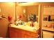 Functional bathroom featuring a well-lit vanity with storage and a neatly arranged toilet area maximizing space at 14353 E 1St Dr # 201, Aurora, CO 80011