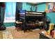 Fun, kid-friendly bedroom with a sturdy bunk bed and bright, playful Mario-themed decorations adding character at 14353 E 1St Dr # 201, Aurora, CO 80011