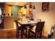 Open dining area connected to the kitchen, featuring a modern light fixture and comfortable seating at 14353 E 1St Dr # 201, Aurora, CO 80011