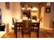 Functional dining room with wooden table and chairs, and a view of the laundry room at 14353 E 1St Dr # 201, Aurora, CO 80011
