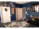 Cozy bedroom showcasing a well-lit interior, with a bed with skeleton decor and a variety of wall decorations at 14353 E 1St Dr # 201, Aurora, CO 80011