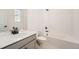 Bathroom featuring modern fixtures, white tiling and a bathtub at 27742 E 1St Ave, Aurora, CO 80018