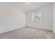 Neutral bedroom with carpet flooring, single window and empty space at 27742 E 1St Ave, Aurora, CO 80018