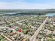Panoramic neighborhood shot showcasing a cozy home in a well-situated location with surrounding lake backdrop at 6671 Grove St, Denver, CO 80221