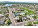 Wide aerial shot of neighborhood with a school and public swimming pool at 6671 Grove St, Denver, CO 80221