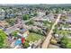 Neighborhood aerial shot featuring a yellow house and lush greenery at 6671 Grove St, Denver, CO 80221