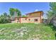 Spacious backyard with a mix of grass, offering potential for outdoor activities and landscaping at 6671 Grove St, Denver, CO 80221