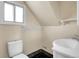 Small bathroom with classic fixtures, including a toilet and sink at 6671 Grove St, Denver, CO 80221