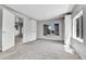 Bright bedroom with carpet flooring, built-in shelves, and neutral gray walls at 6671 Grove St, Denver, CO 80221