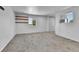 Bedroom with white walls, neutral carpet, shelving, and a closet with full mirror door at 6671 Grove St, Denver, CO 80221