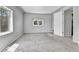 Bright bedroom with plush carpeting, neutral walls, and a sunny window at 6671 Grove St, Denver, CO 80221