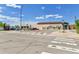 Modern public library with ample parking, crosswalks, and well-maintained landscaping at 6671 Grove St, Denver, CO 80221