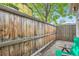 Private backyard brick patio and wood fence create a cozy atmosphere at 2562 N Emerson St, Denver, CO 80205
