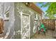 Cinder block exterior with brick patio and wood fence at 2562 N Emerson St, Denver, CO 80205