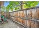 Backyard area featuring wood fence and brick patio at 2562 N Emerson St, Denver, CO 80205
