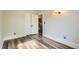 Bright bedroom features wood-look floors, closet, and neutral paint at 2562 N Emerson St, Denver, CO 80205