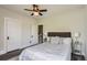 Bedroom with a ceiling fan, hardwood flooring, and two windows at 2562 N Emerson St, Denver, CO 80205