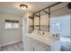Functional laundry room with tile floors, washer, dryer, and built-in shelving for optimal storage at 2562 N Emerson St, Denver, CO 80205