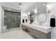 Bright bathroom featuring large shower, double vanity, large mirrors, and modern fixtures at 1126 S Garfield St, Denver, CO 80210
