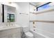 Bathroom with bathtub, sink, toilet and gold fixtures at 1126 S Garfield St, Denver, CO 80210