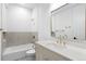 Bathroom with a tub and shower combination, stylish tile accents and modern fixtures at 1126 S Garfield St, Denver, CO 80210