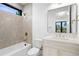 Modern bathroom featuring bathtub, sink, toilet and gold fixtures at 1126 S Garfield St, Denver, CO 80210