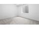 A carpeted basement bedroom with a window and recessed lighting at 1126 S Garfield St, Denver, CO 80210