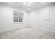 A carpeted basement bedroom with a window and recessed lighting at 1126 S Garfield St, Denver, CO 80210