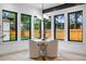 Bright dining nook featuring a round table, comfortable seating, and natural light from large windows at 1126 S Garfield St, Denver, CO 80210