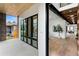 Modern entryway with black framed windows and an open view into the home's interior at 1126 S Garfield St, Denver, CO 80210
