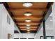 Stylish hallway featuring wood beam ceilings, recessed lighting, and an open view to other rooms at 1126 S Garfield St, Denver, CO 80210