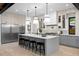 Bright, spacious kitchen featuring an island with seating, modern appliances, and ample storage at 1126 S Garfield St, Denver, CO 80210