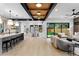 Open layout with view of kitchen, dining and living spaces with backyard access at 1126 S Garfield St, Denver, CO 80210