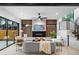 Bright living room with fireplace, stylish furniture, and modern open staircase at 1126 S Garfield St, Denver, CO 80210