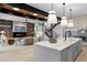 Bright, modern living space with open kitchen, fireplace, and distinctive staircase design at 1126 S Garfield St, Denver, CO 80210